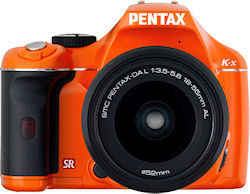 Pentax's K-x digital SLR, front view in orange body color. Photo provided by Pentax Imaging Co. Click for a bigger picture!