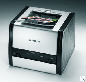 Olympus' P-11 photo printer. Courtesy of Olympus, with modifications by Michael R. Tomkins. Click for a bigger picture!