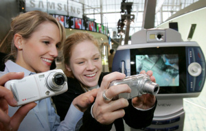 Samsung's camera phones on display. Courtesy of Samsung, with modifications by Michael R. Tomkins. Click for a bigger picture!