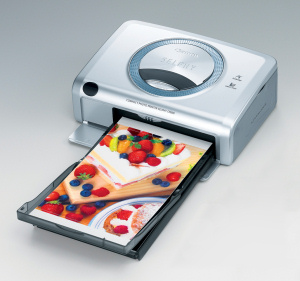 Canon's SELPHY CP600 dye sublimation photo printer. Courtesy of Canon, with modifications by Michael R. Tomkins. Click for a bigger picture!