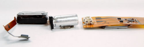 This supercapacitor-powered LED flash module reference design, developed by ON Semiconductor, uses a thin CAP-XX HA230 supercapacitor (on the underside) and the ON Semiconductor NCP5680 flash driver to drive high-current Lumileds LEDs. Also pictured (left) for comparison is the Nokia N82 xenon flash solution with its large, cylindrical electrolytic capacitor. Photo and caption provided by CAP-XX Ltd. Click for a bigger picture!
