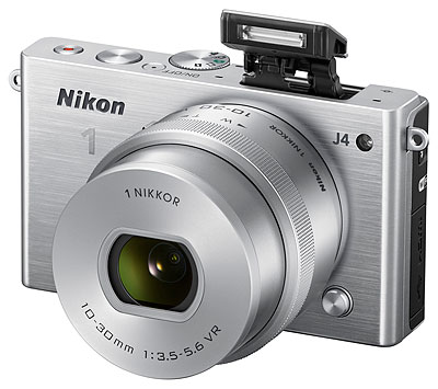 Nikon J4 Review -- 3/4 front view, silver with flash