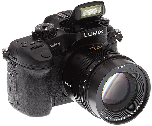 Panasonic GH4 Review -- 3/4 front right view with flash deployed