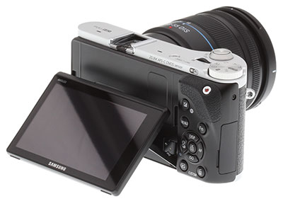 Samsung NX300 Review -- Rear 3/4 view showing AMOLED monitor articulated