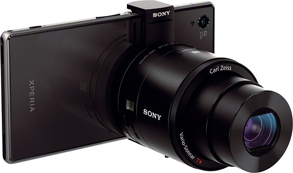 Sony QX100 review -- Front quarter view with smartphone