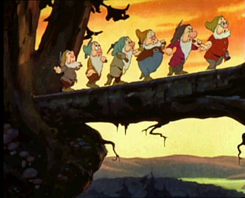 I have to wonder why there are only 6 Dwarves. Which one is missing? Itâ€™s kind of blurry, but Iâ€™m pretty sure the one in the front is carrying a Sony 18-200. The silver one. Public domain image from 1937 Snow White trailer, courtesy Wikipedia.