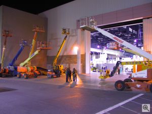 A sneak peek past some of the vast array of construction equipment required to set up a show like Comdex, into the show hall itself, the night before the show opens. Copyright (c) 2000, Michael R. Tomkins, all rights reserved. Click for a bigger picture!
