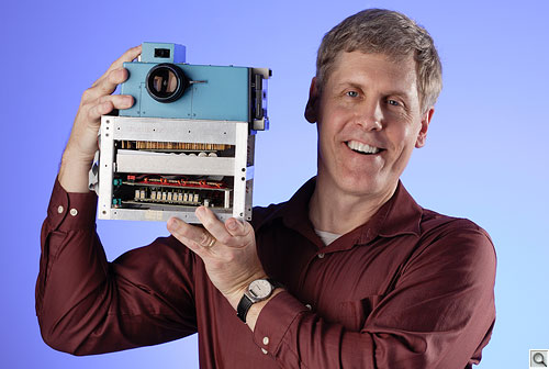 Kodak's Steven J. Sasson holding first digital camera.