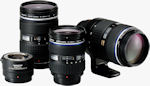 Olympus' new Zuiko lenses and teleconverter. Courtesy of Olympus, with modifications by Michael R. Tomkins.