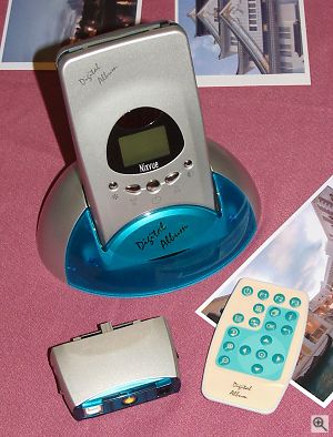 Nixvue's Digital album, shown with docking station and remote control alongside the newly announced portable dock. Copyright © 2001, Michael R. Tomkins. All rights reserved. Click for a bigger picture!