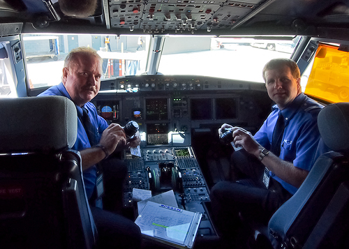 JetBlue's flight deck crew gets a look at the Olympus PEN E-PM1 compact system camera. Photo provided by Olympus Imaging America Inc. Click for a bigger picture!