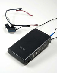 Mobile spectacle-type wearable retinal imaging display. Photo provided by Brother Industries Ltd.