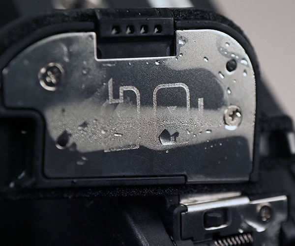 Canon EOS R Review -- Close-up of battery compartment door after testing.