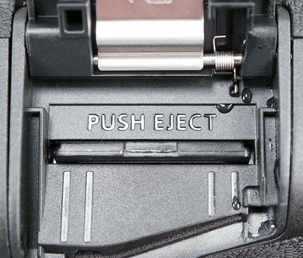 Canon EOS R Review -- close-up of memory card compartment door interior.