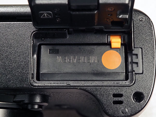 Canon EOS R Review -- close-up of memory card compartment door interior.