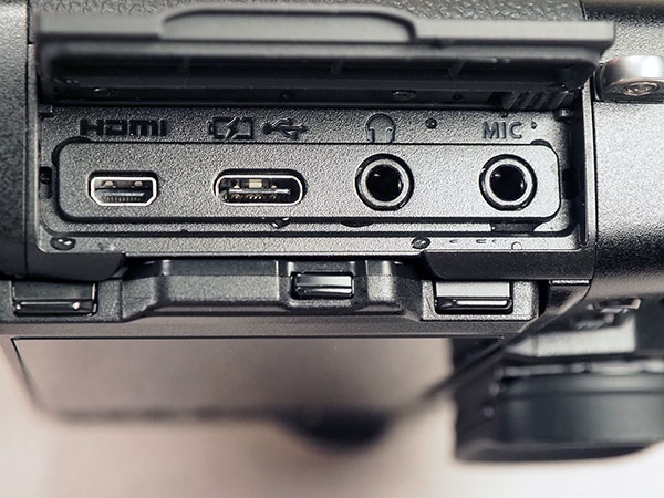 Canon EOS R Review -- extreme close-up of memory card compartment door hinge.