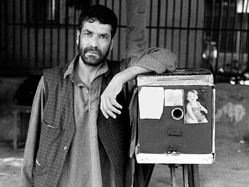 Kamra-E-Faoree street photographer Qalam Nabi, with his box camera. Photo courtesy of the Afghan Box Camera Project / Kickstarter. Click for a bigger picture!