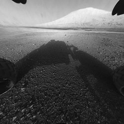 Hazard Avoidance camera shot with dust cover off. Photo provided by NASA/JPL-Caltech. Click for a bigger picture!