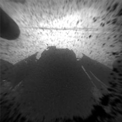 Hazard Avoidance camera shot with dust cover on. Photo provided by NASA/JPL-Caltech. Click for a bigger picture!